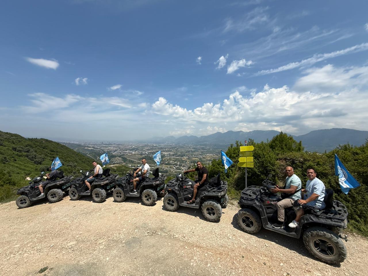 Row of quad bikes overlooking Tirana valley